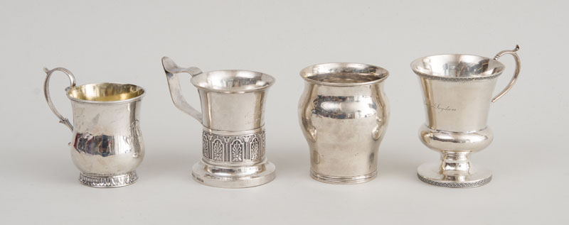 Appraisal: THREE AMERICAN SILVER MUGS AND A BALUSTER-FORM CUP The smallest