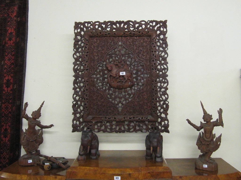 Appraisal: Carved Burmese firescreen pair of figures and gong