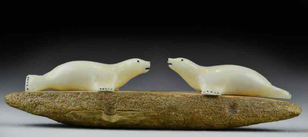 Appraisal: Inuit Ivory Carving of Two Seals on StoneTwo finely carved