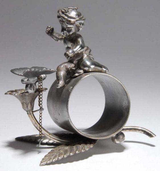 Appraisal: Cherub with Butterfly Figural Napkin Ring Description Cherub sits on