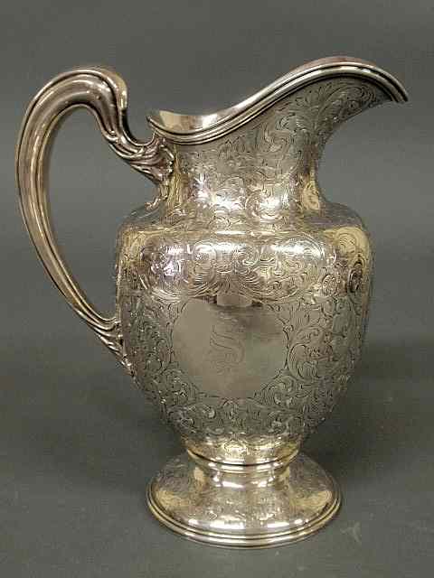 Appraisal: Sterling silver water pitcher with leafy engraved decoration and monogrammed