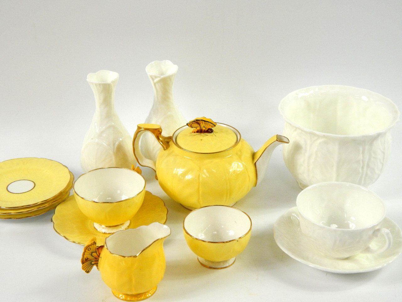 Appraisal: An Aynsley porcelain yellow ground tete-a-tete tea service with butterfly