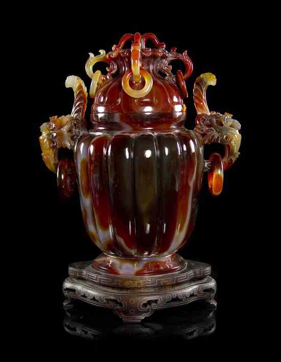 Appraisal: An Agate Lidded Censer of lobed form having free-moving rings