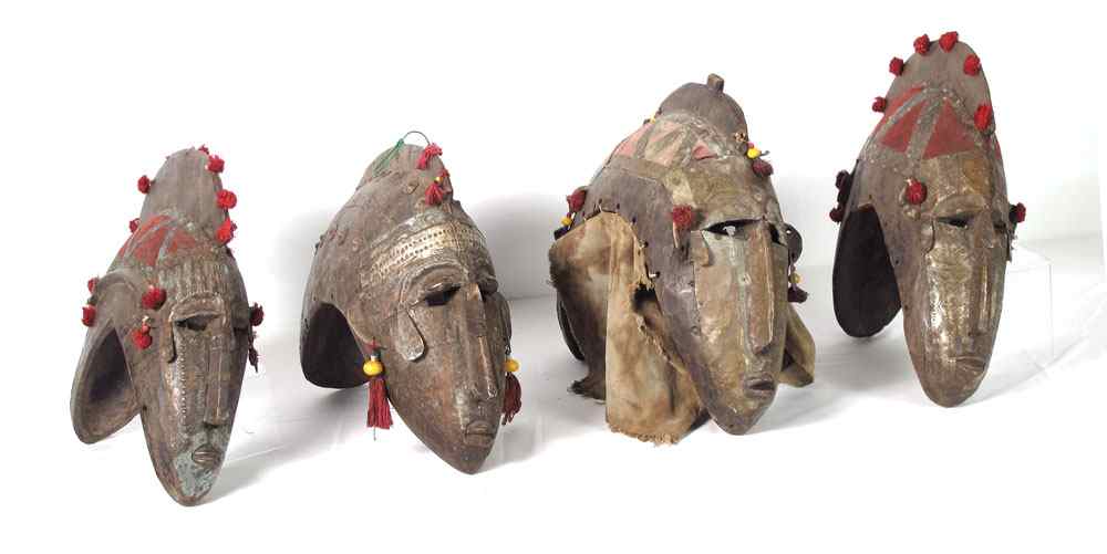 Appraisal: CARVED AFRICAN BAMELEKE JANUS HEADS LBS LBS LBS LBS ''