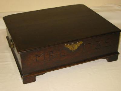 Appraisal: AN OAK TABLE BOX of shallow oblong form with hinged