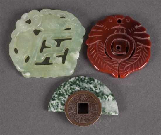 Appraisal: Group of carved Chinese amulets including carnelian jade colored hardstone