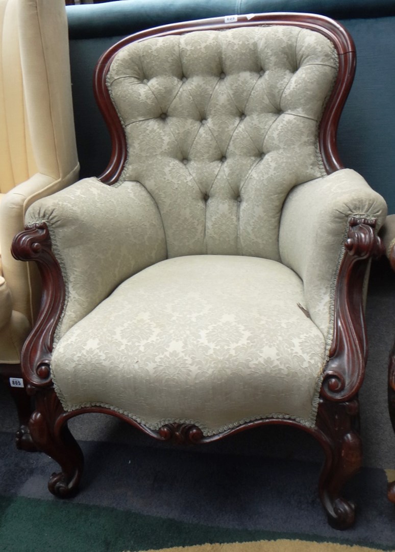 Appraisal: A Victorian mahogany framed button back armchair with serpentine seat