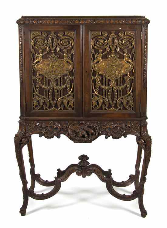 Appraisal: A Continental Cabinet on Stand the carved cornice above two