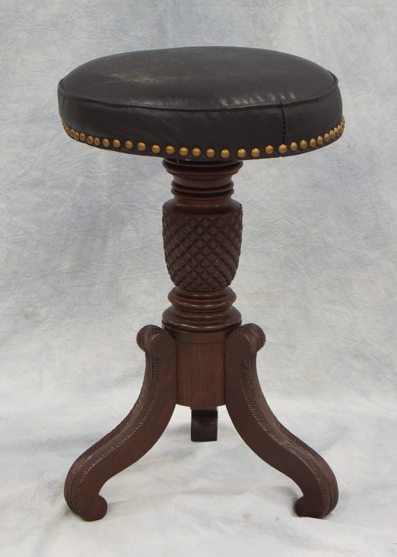 Appraisal: Carved mahogany Federal stool feather carved legs and pineapple carved