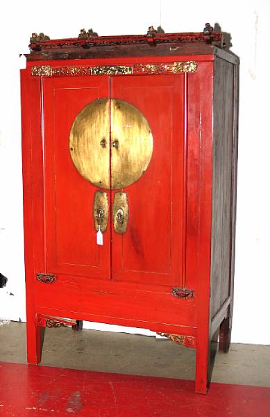 Appraisal: A painted wood two-door cabinet The frame painted red with