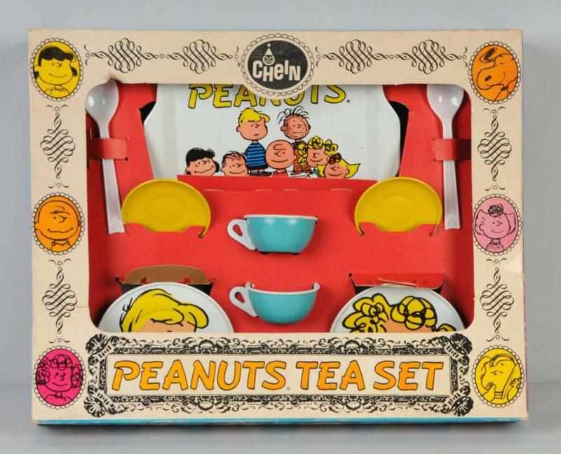 Appraisal: Tin Chein Peanuts Tea Set Toy Description American Includes two