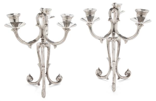 Appraisal: A pair of Mexican sterling metamorphic candelabra each bob che