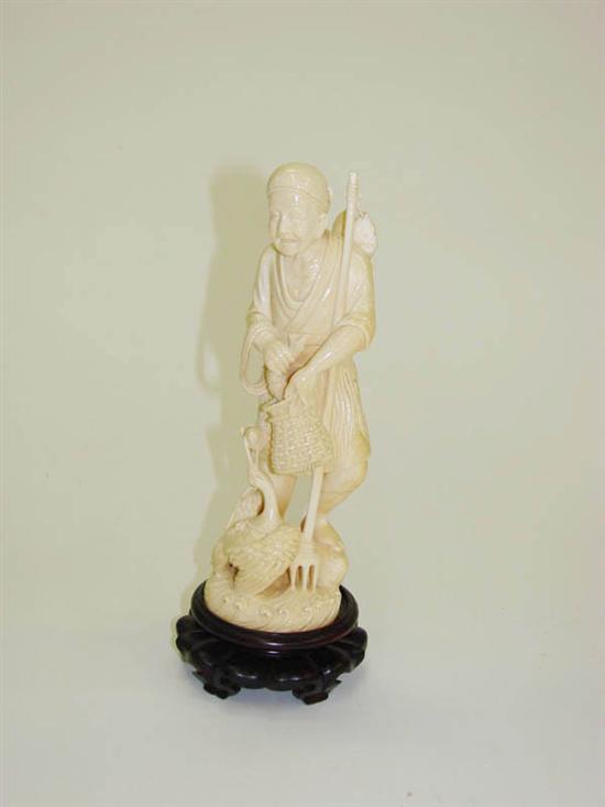 Appraisal: IVORY CARVING OF A FISHERMAN Japan late th-early th century