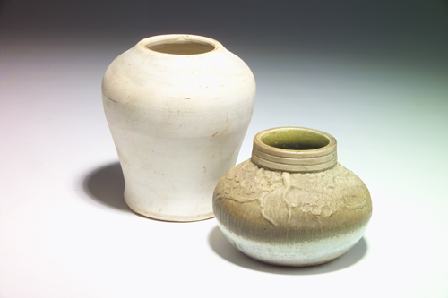 Appraisal: TIFFANY Two bisque-fired bulbous vases of white clay one modeled