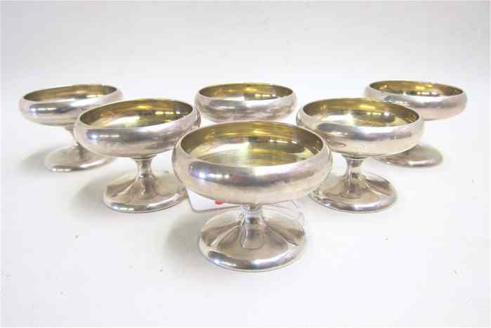 Appraisal: SET OF SIX STERLING SILVER PEDESTAL NUT CUPS with gilt