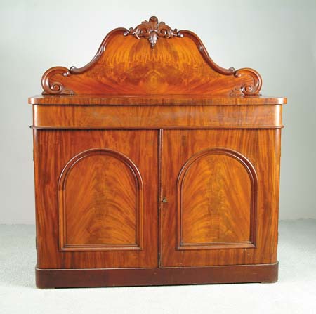 Appraisal: ANTIQUE MAHOGANY SIDEBOARD Rounded corner top has secret type long