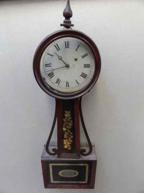 Appraisal: Antique Banjo Clock with Reverse Painted Glass A vintage clock