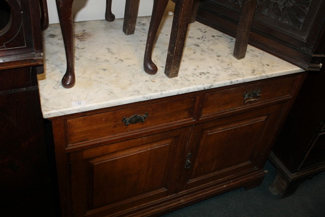 Appraisal: AN EDWARDIAN SATIN WOOD WALNUT CUPBOARD with an arrangement of