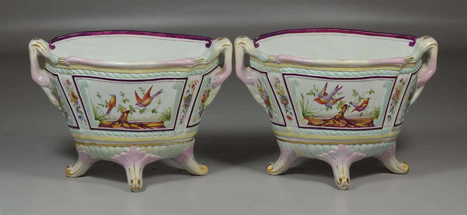 Appraisal: Pair of Continental enameled pottery footed mantle vases with birds