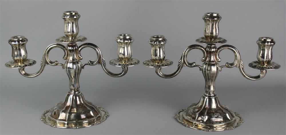 Appraisal: PAIR OF PERUVIAN SILVER THREE-LIGHT CANDELABRA maker's marks for Camusso