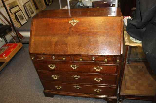 Appraisal: A GEORGE III OAK FALL FRONT BUREAU with fitted interior