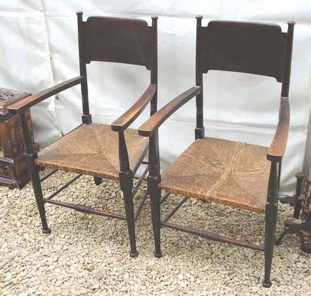 Appraisal: A PAIR OF ARTS AND CRAFTS OAK OPEN ARMCHAIRS with