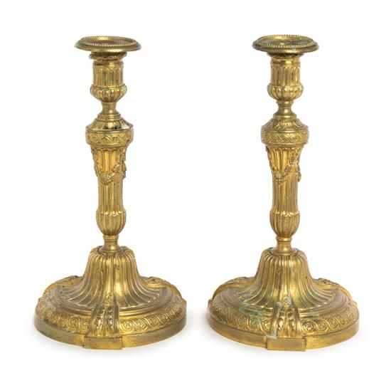 Appraisal: Sale Lot A Pair of Neoclassical Style Gilt Metal Candlesticks