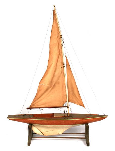 Appraisal: A fully rigged pond yacht with plank painted hull height