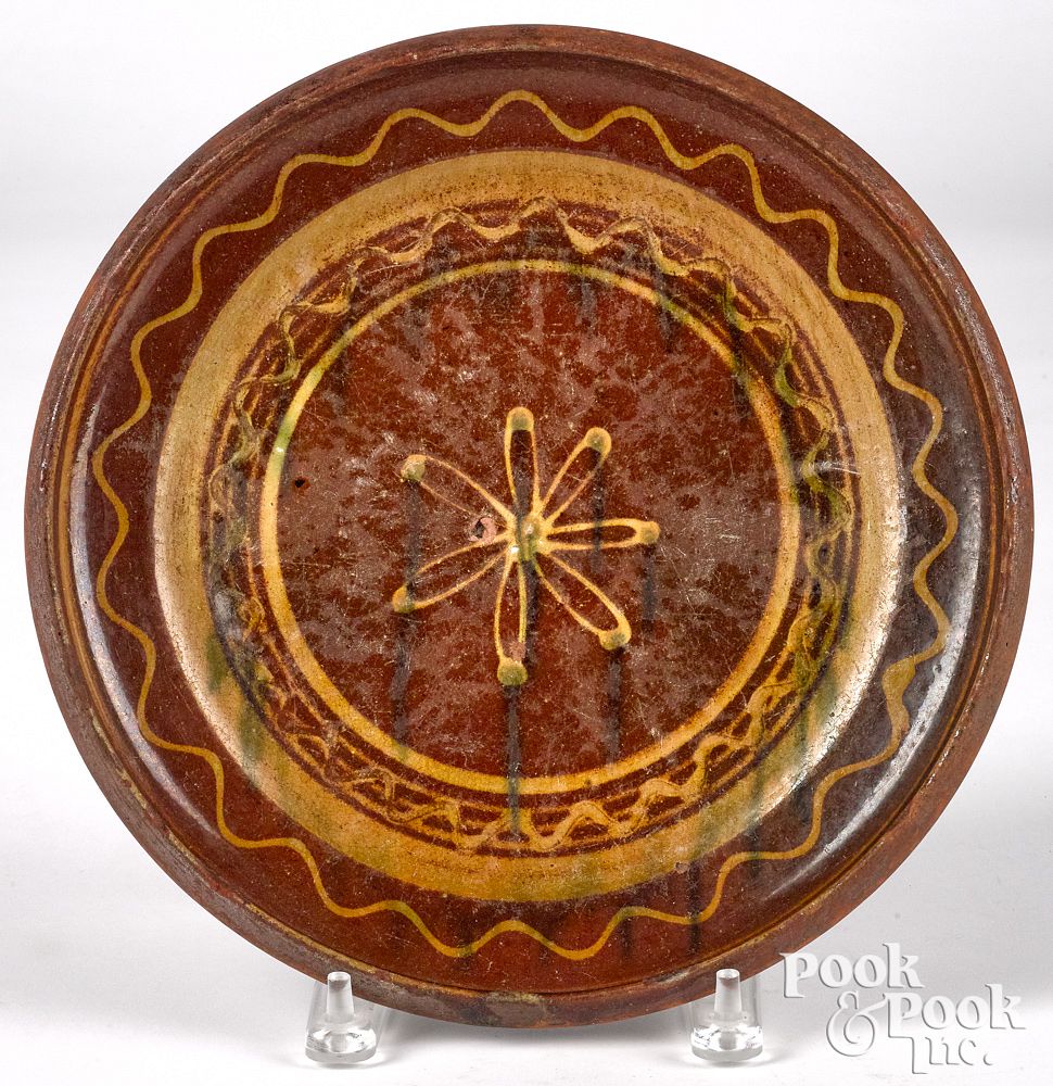 Appraisal: Continental redware decorated plate Continental redware multi-glaze slip decorated plate