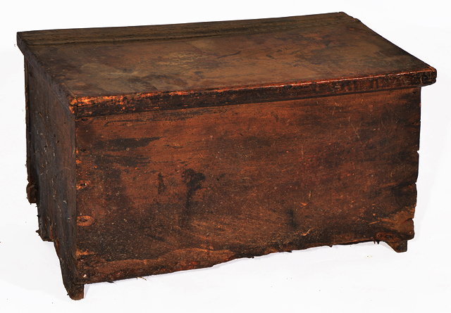 Appraisal: AN ANTIQUE SIX-PLANK COFFER with a leather hinged lid and