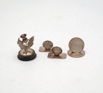 Appraisal: A small collection of silver menu holders comprising An Edwardian