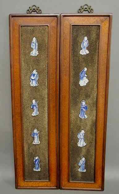 Appraisal: Two Chinese wood framed panels with inset vertical rows of