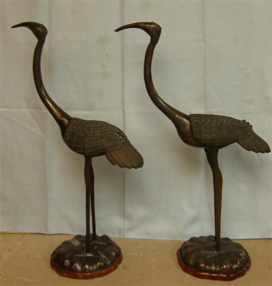 Appraisal: Pair of bronzed cast metal cranes th century standing with