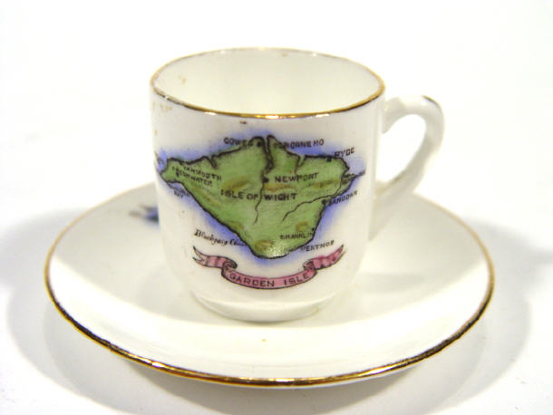 Appraisal: Miniature Foley bone china cup and saucer hand coloured and