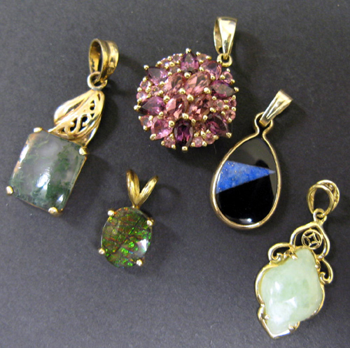 Appraisal: FIVE GEMSTONE AND YELLOW GOLD PENDANTS Including onyx lapis and