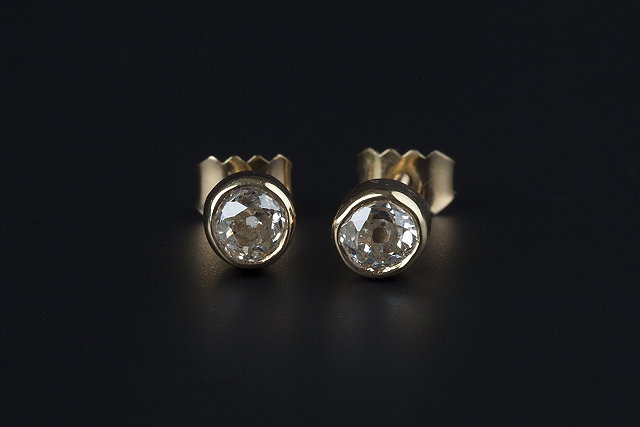 Appraisal: A PAIR OF DIAMOND EARSTUDS each old-cut diamond in collet