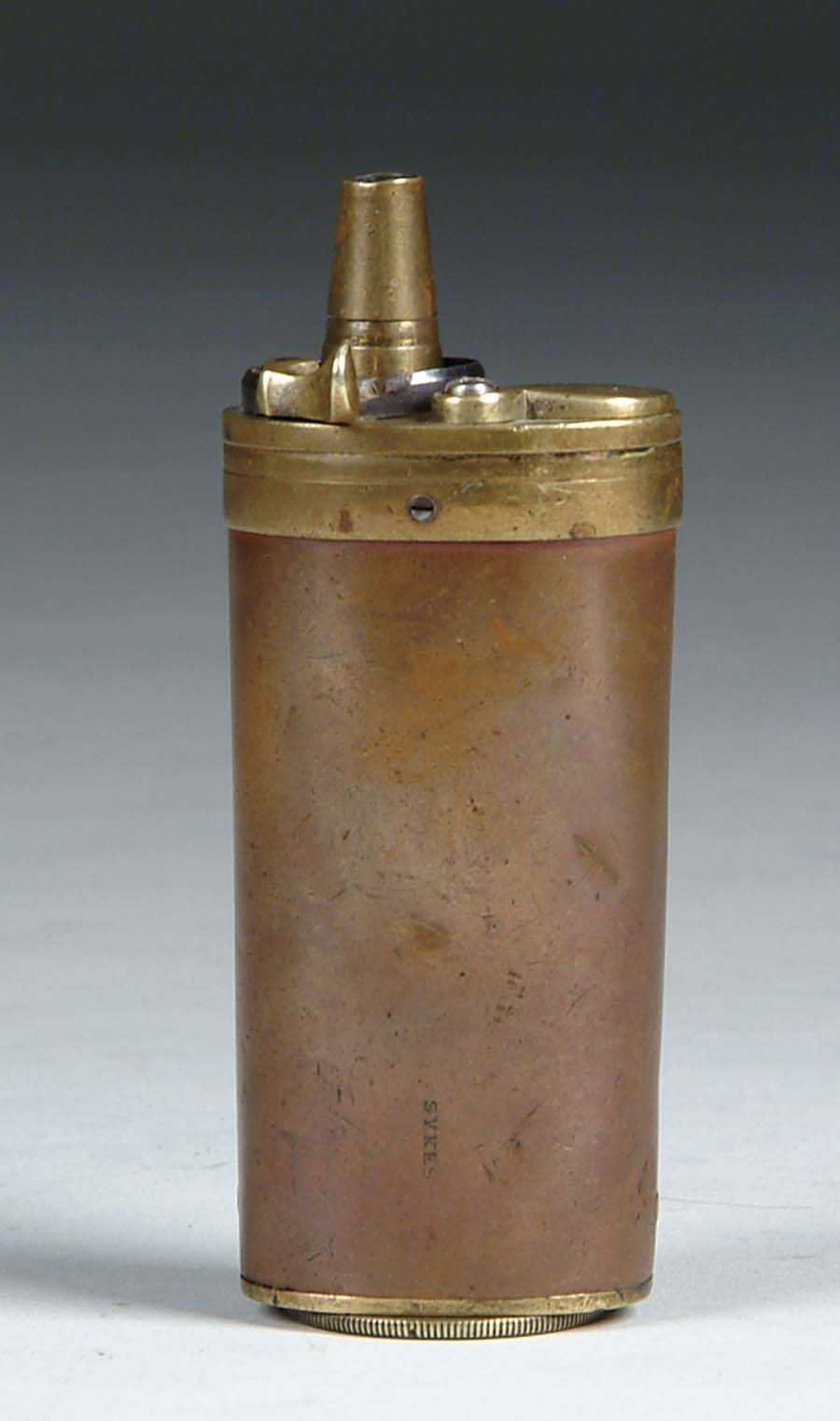 Appraisal: SYKES SMALL -COMPARTMENT PISTOL FLASK Copper brass tapered oval shape