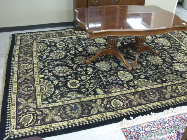 Appraisal: HAND KNOTTED ORIENTAL CARPET Indo-Persian overall floral decoration on black