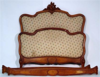 Appraisal: French walnut and upholstered bedsteadBoth head and footboard with shaped