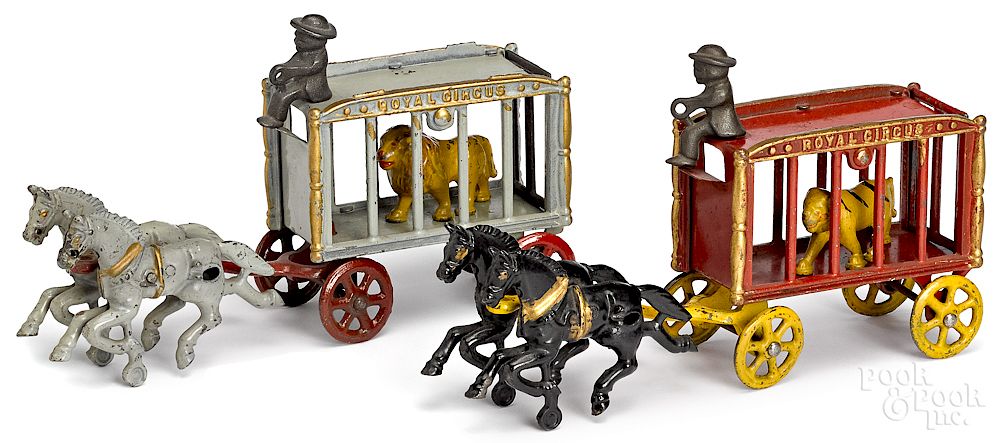 Appraisal: Two cast iron horse drawn Royal Circus cage wagons Two