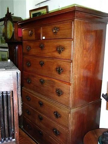 Appraisal: A GEORGE III MAHOGANY TALLBOY CHEST of two short and