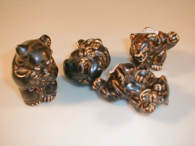 Appraisal: Four Royal Copenhagen brown glazed bears