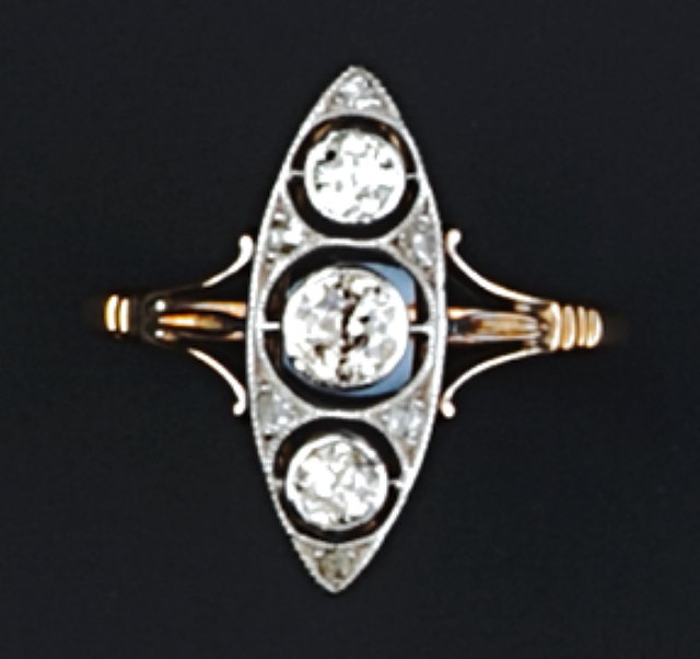 Appraisal: A DIAMOND PANEL RING the pierced navette-shaped panel millegrain set