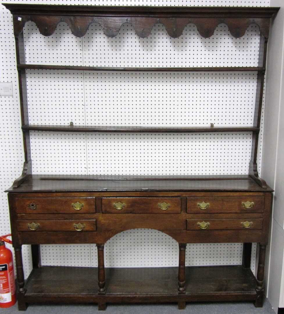 Appraisal: A George III oak pot board dresser with open plate