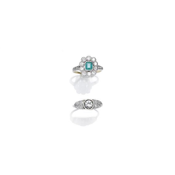 Appraisal: A DIAMOND RING and AN EMERALD AND DIAMOND RING circa