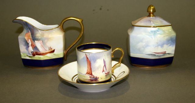 Appraisal: A Caverswall coffee set painted with marine subjects by R