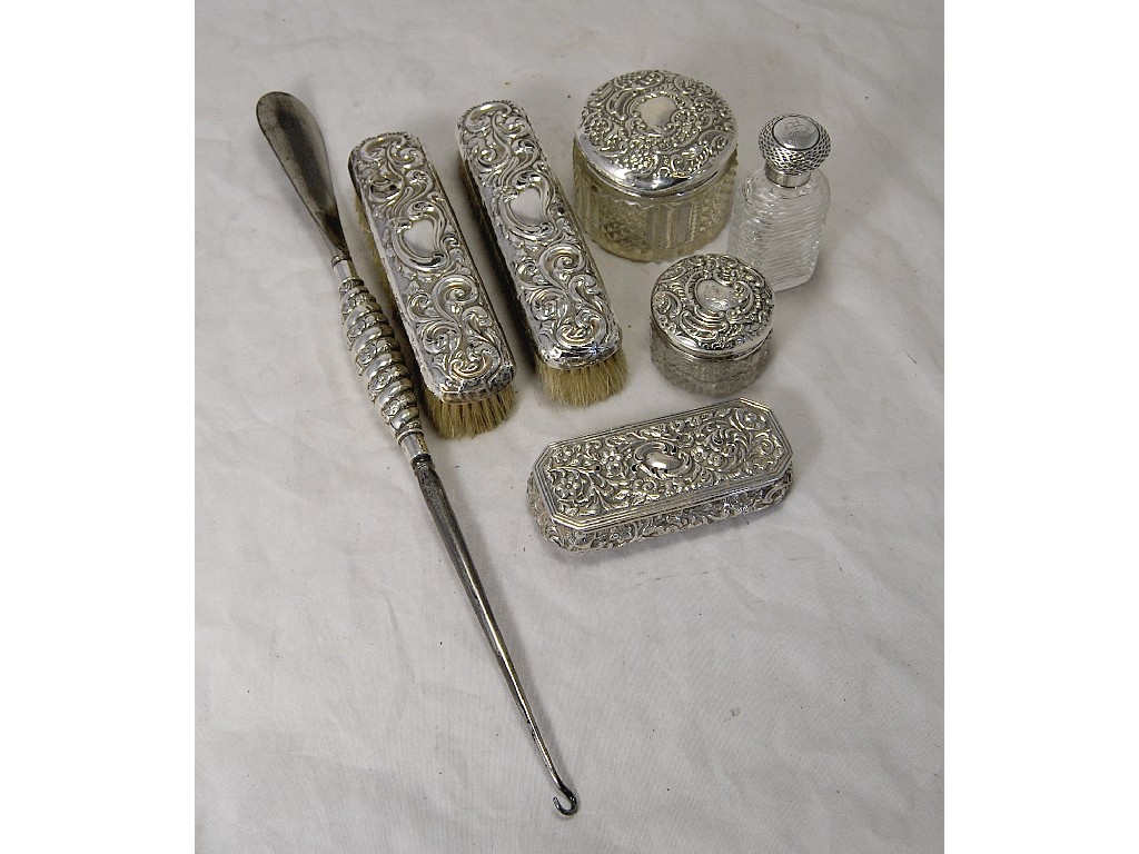 Appraisal: Two dressing table jars with silver lids a silver topped