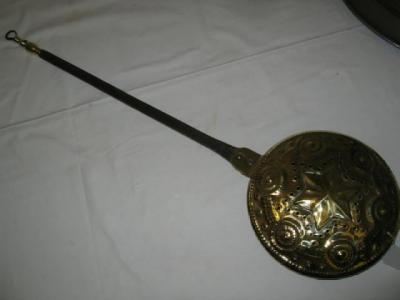 Appraisal: A MINIATURE WARMING PAN CHESTNUT ROASTER the pierced brass lid