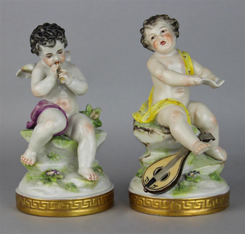 Appraisal: PAIR OF GERMAN PORCELAIN FIGURES OF PUTTI mid- th C