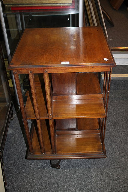 Appraisal: A VICTORIAN WALNUT REVOLVING BOOKCASE with square top cm across